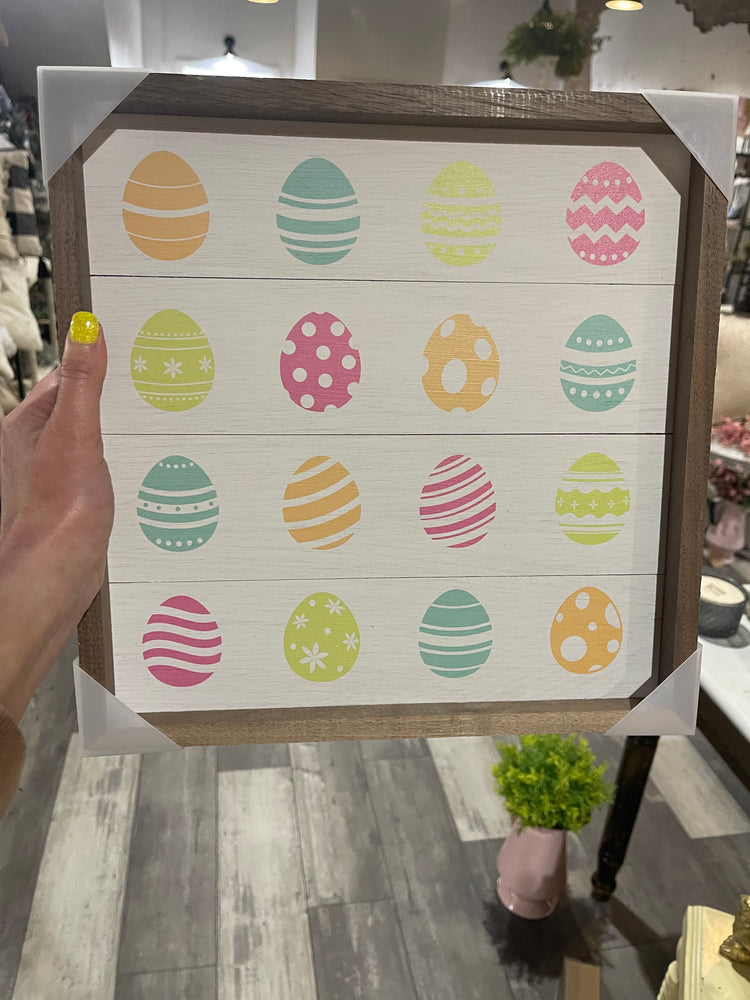 Colorful Eggs on Whitewash Sign